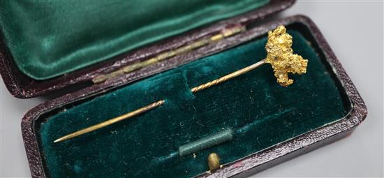 A Victorian yellow metal nugget stick pin, 67mm.